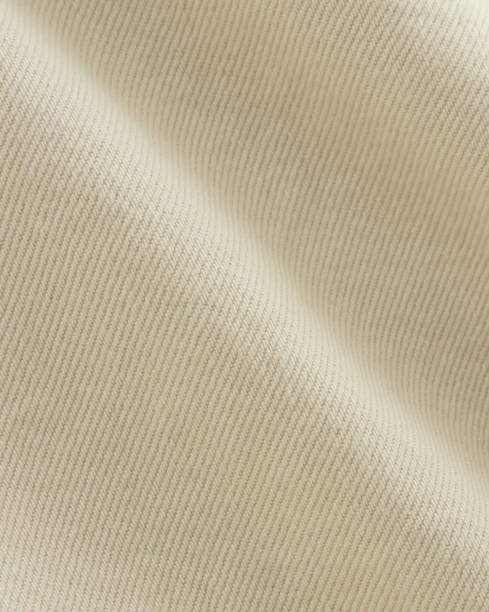 The Long A-Line Denim Short in Garment-Dyed White / Cream — detail view
