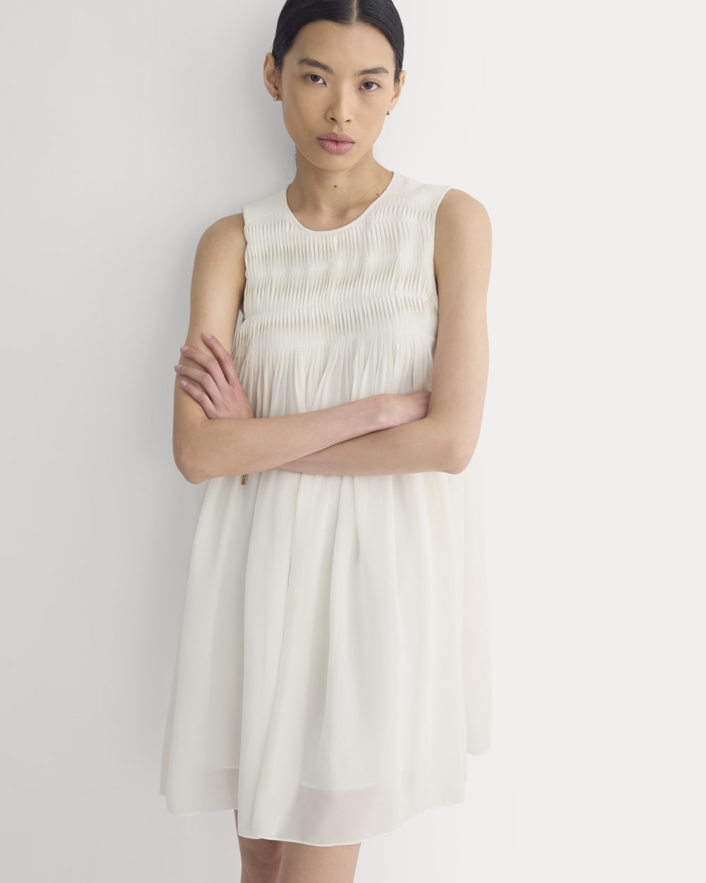 Twisted Pleated Mini Dress in Silk Georgette in Bone — front view