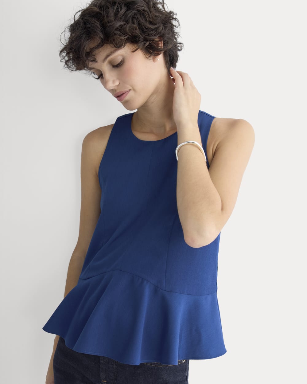 Sleeveless Peplum Top in Estate Blue — front view