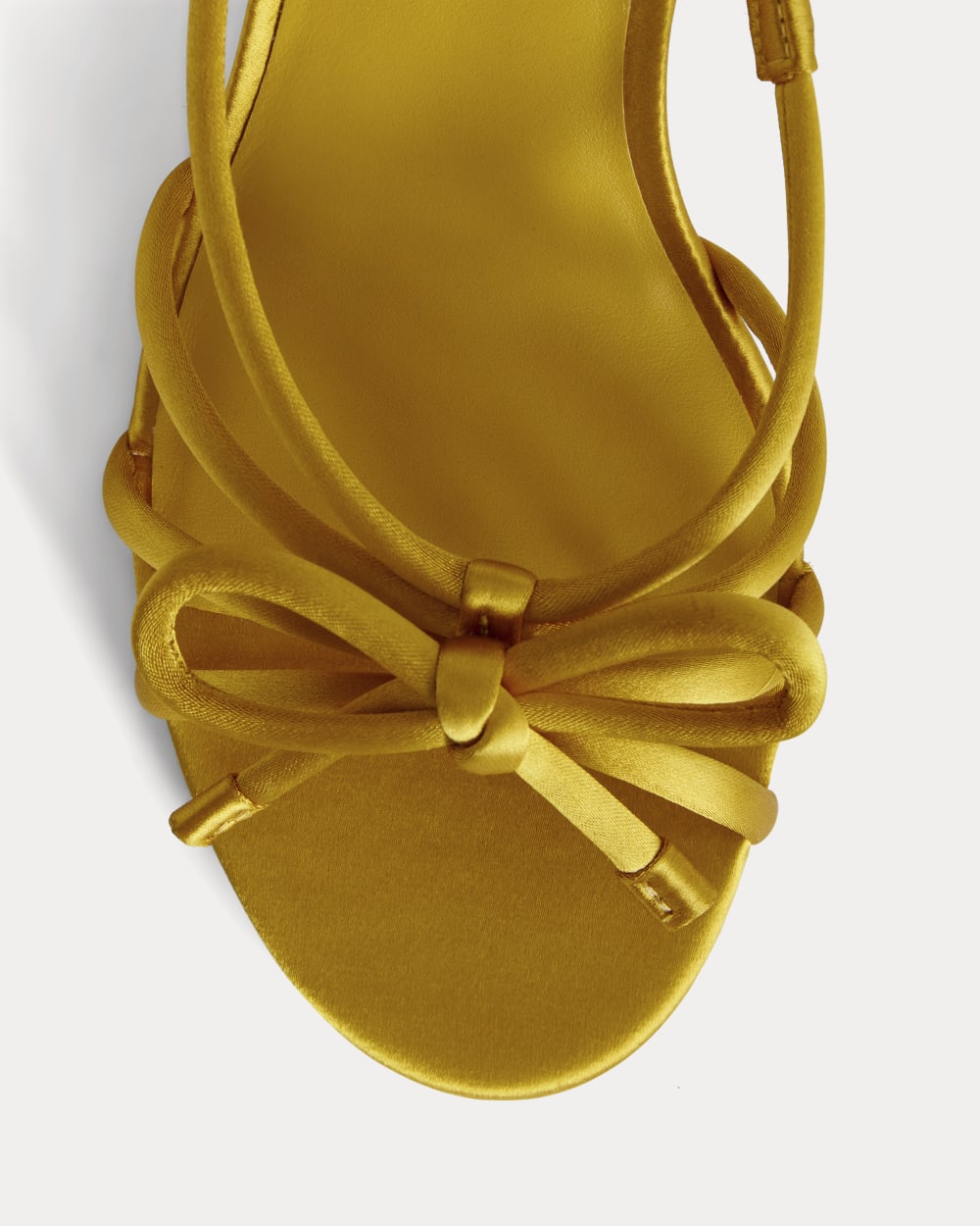 The Bow Heel in Golden Sun Satin — detail view