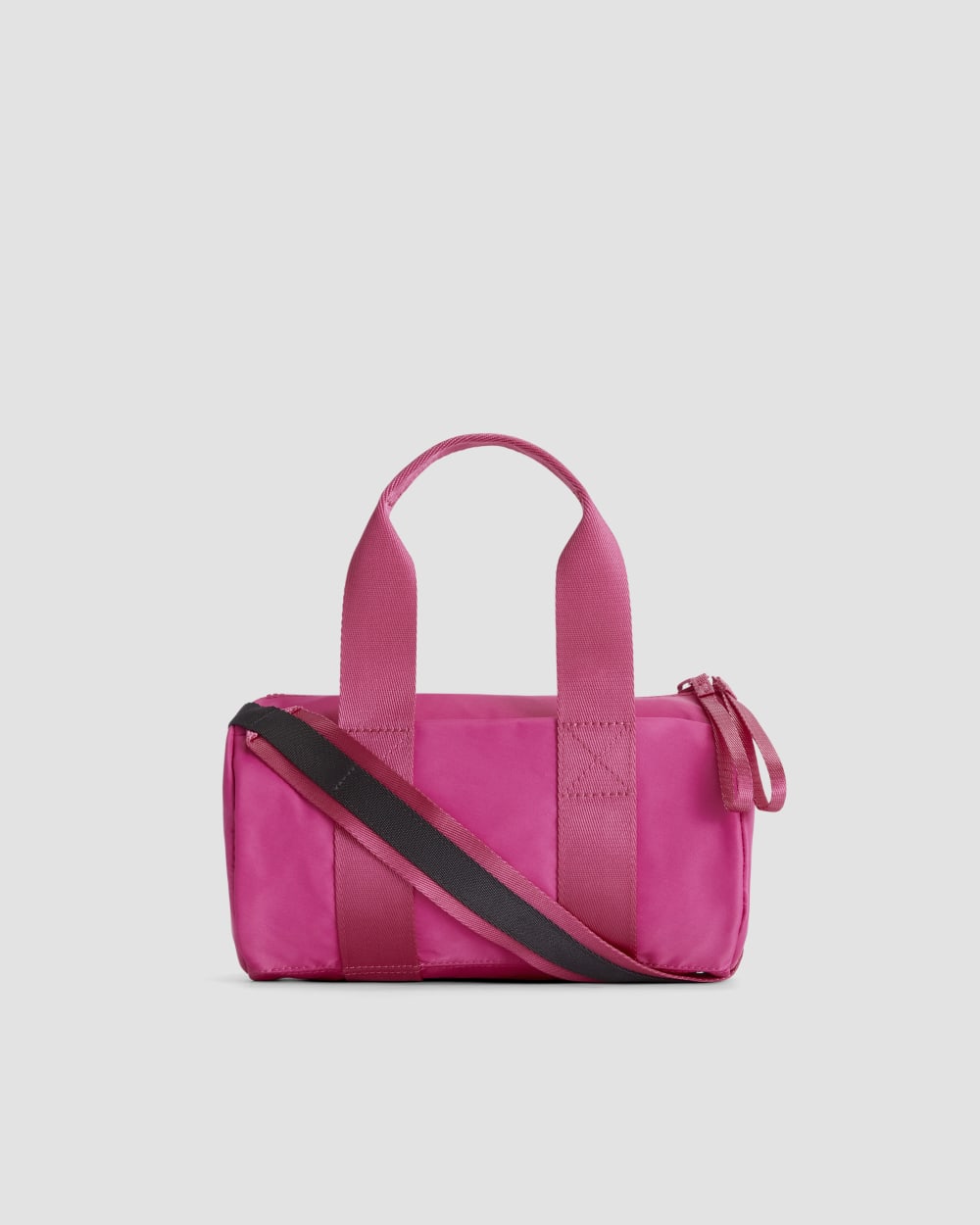 The Recycled Nylon Crossbody in Fuchsia Pink — front view