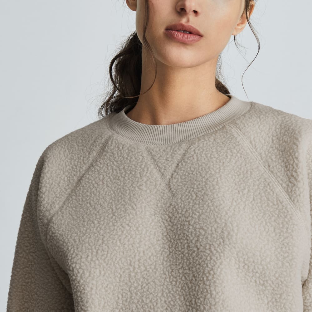 The ReNew Fleece Raglan Sweatshirt in Sandstone — detail view