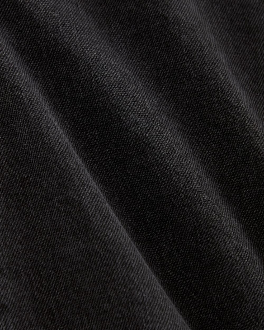 The A-Line Denim Short in Washed Black — detail view