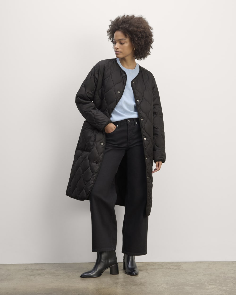 The Long Quilted Liner in Black — front view