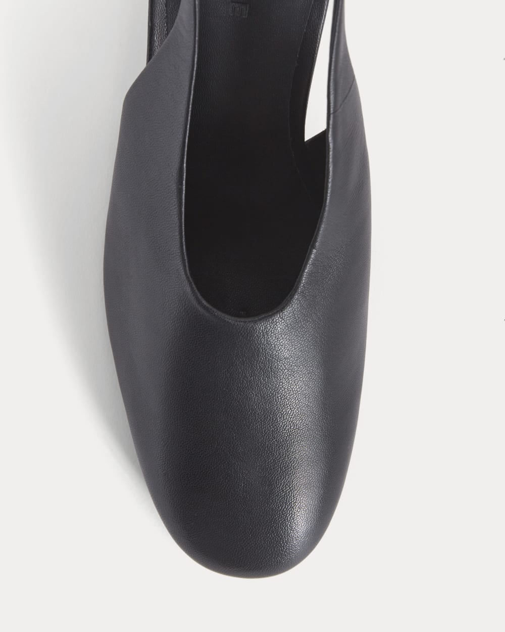 Curved Slingback Heel in Black — detail view