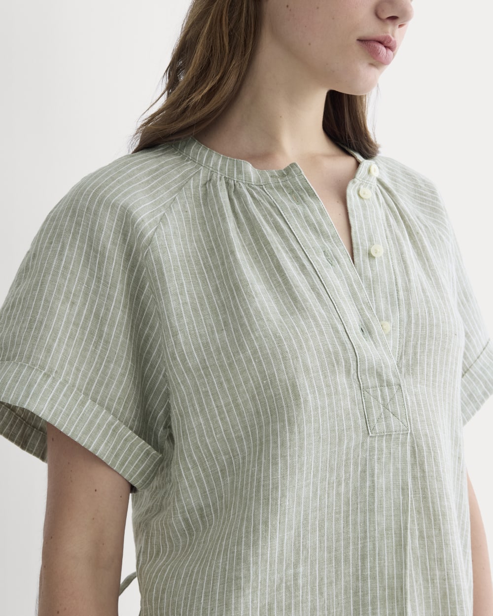 The Popover Dress in Linen in Oil Green / White — detail view