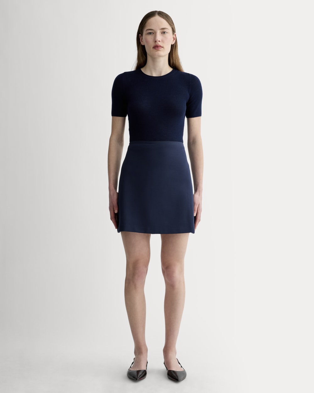 The Dream Mini Skirt in Navy — front view