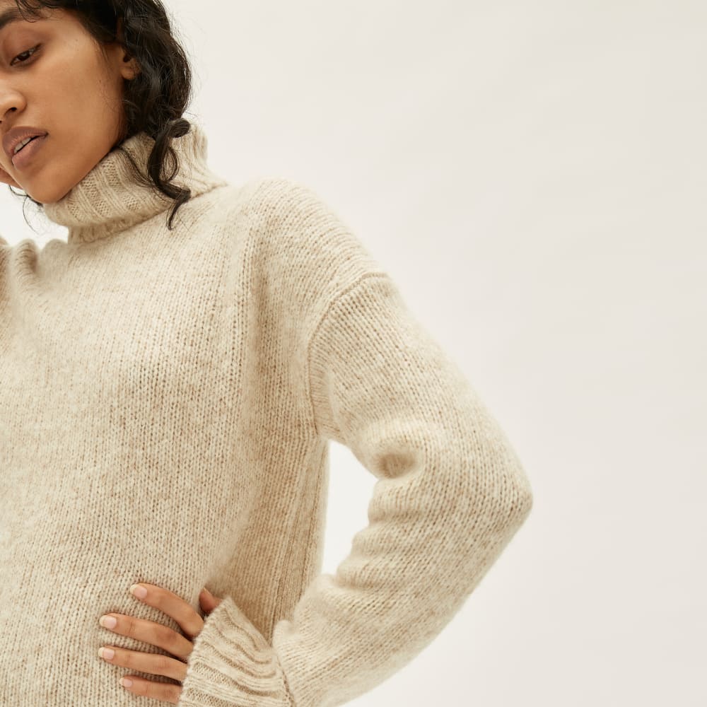 The Cloud Turtleneck in Heathered Ivory — detail view