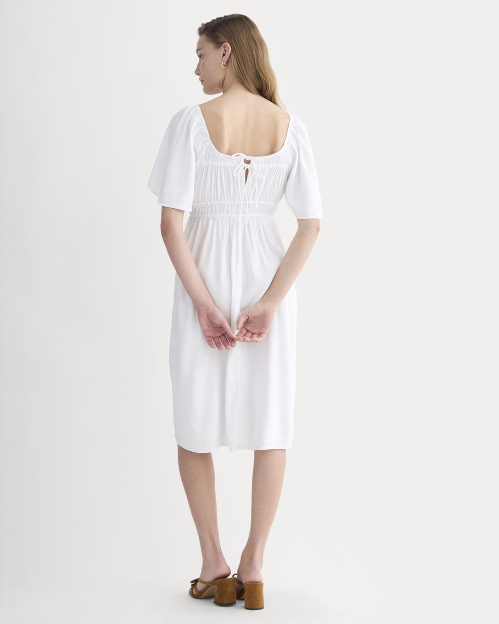 The Flutter-Sleeve Dress in Stretch Linen in White — detail view