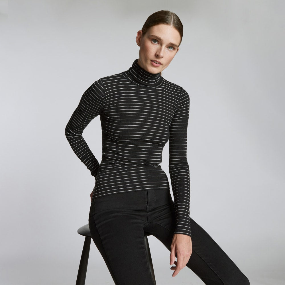 The Luxe Rib Turtleneck in Black / Canvas Tan — detail view