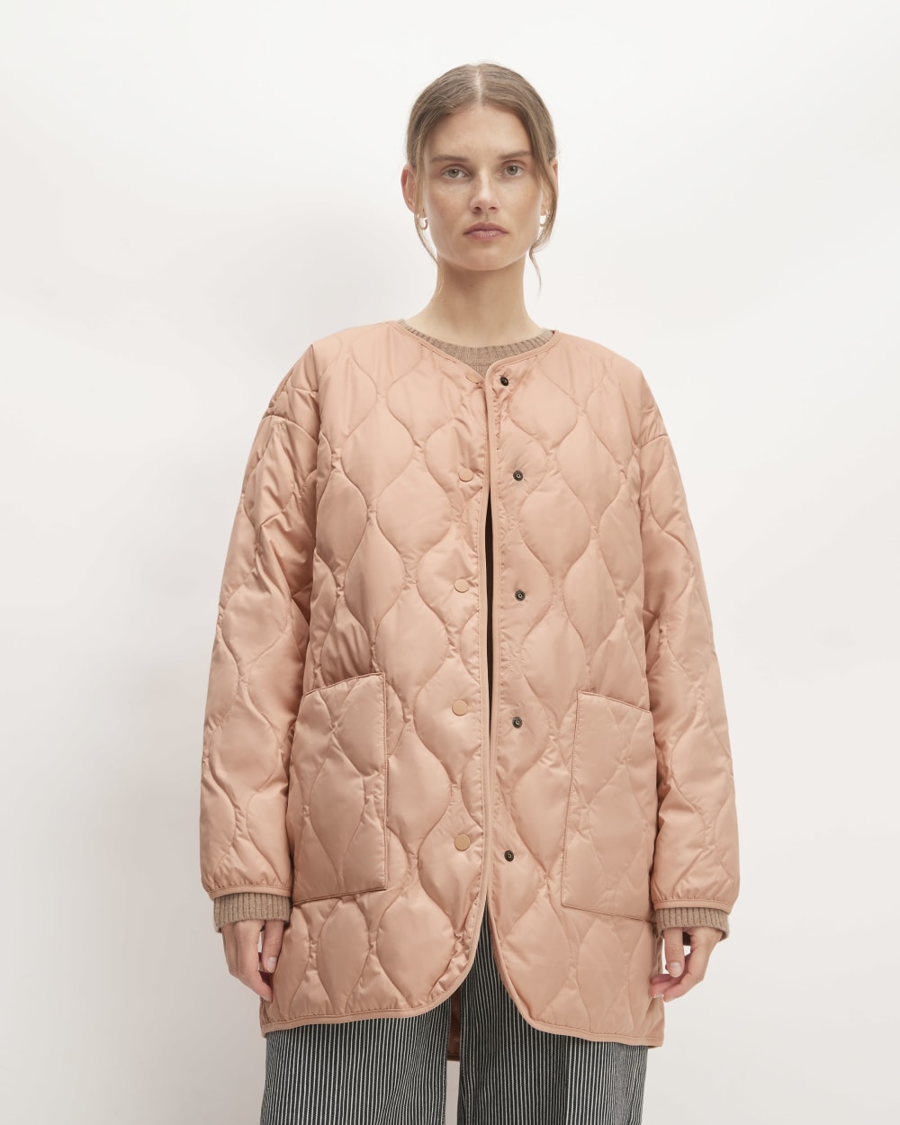 The Quilted Liner in Blush Pink — front view