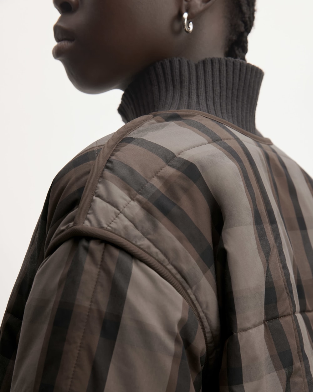 The Quilted Cotton Liner in Abalone / Black / Earth Brown — detail view