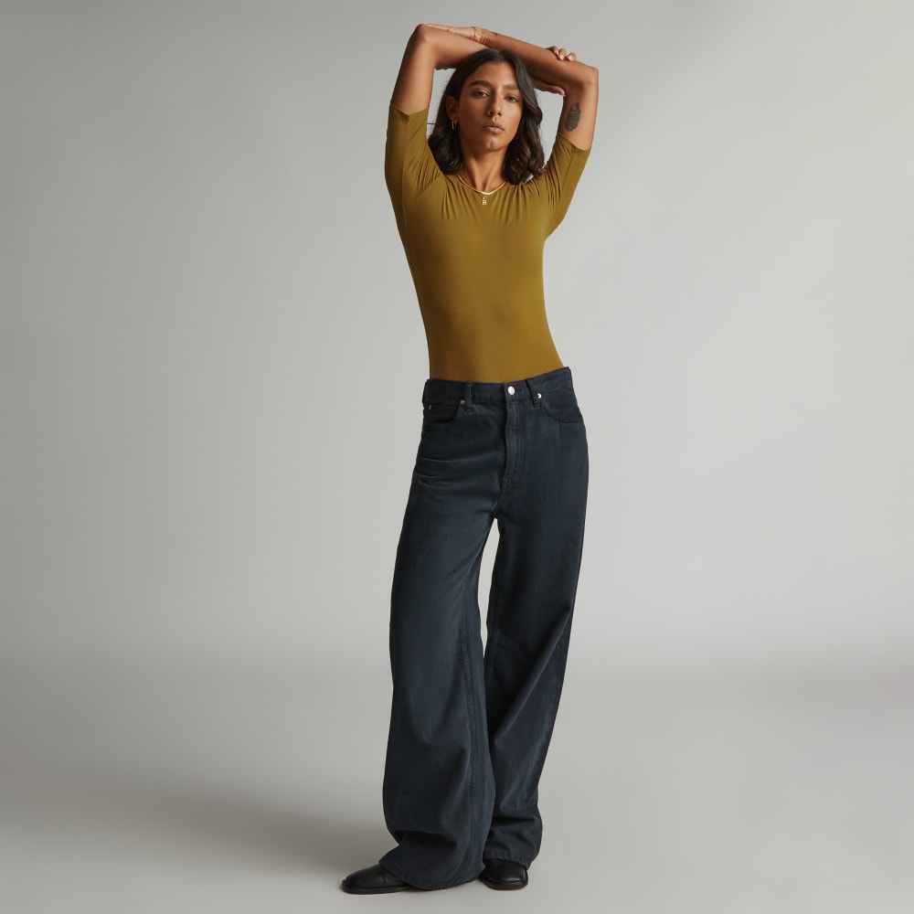 The Short-Sleeve Crew Neck Bodysuit in Tapenade — detail view