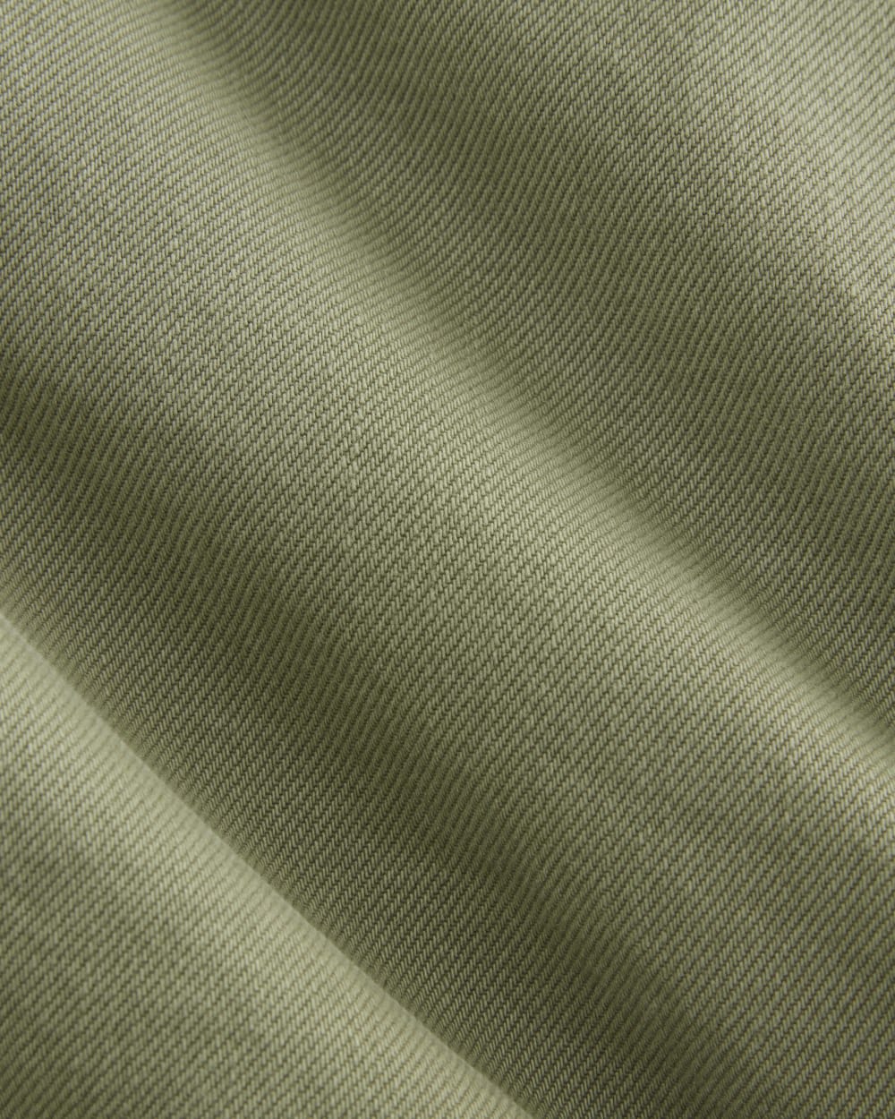 The A-Line Denim Short in Neutral Oil Green — detail view