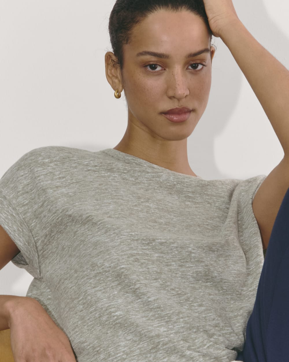 The Perform Tee in Heathered Grey / Olive — detail view