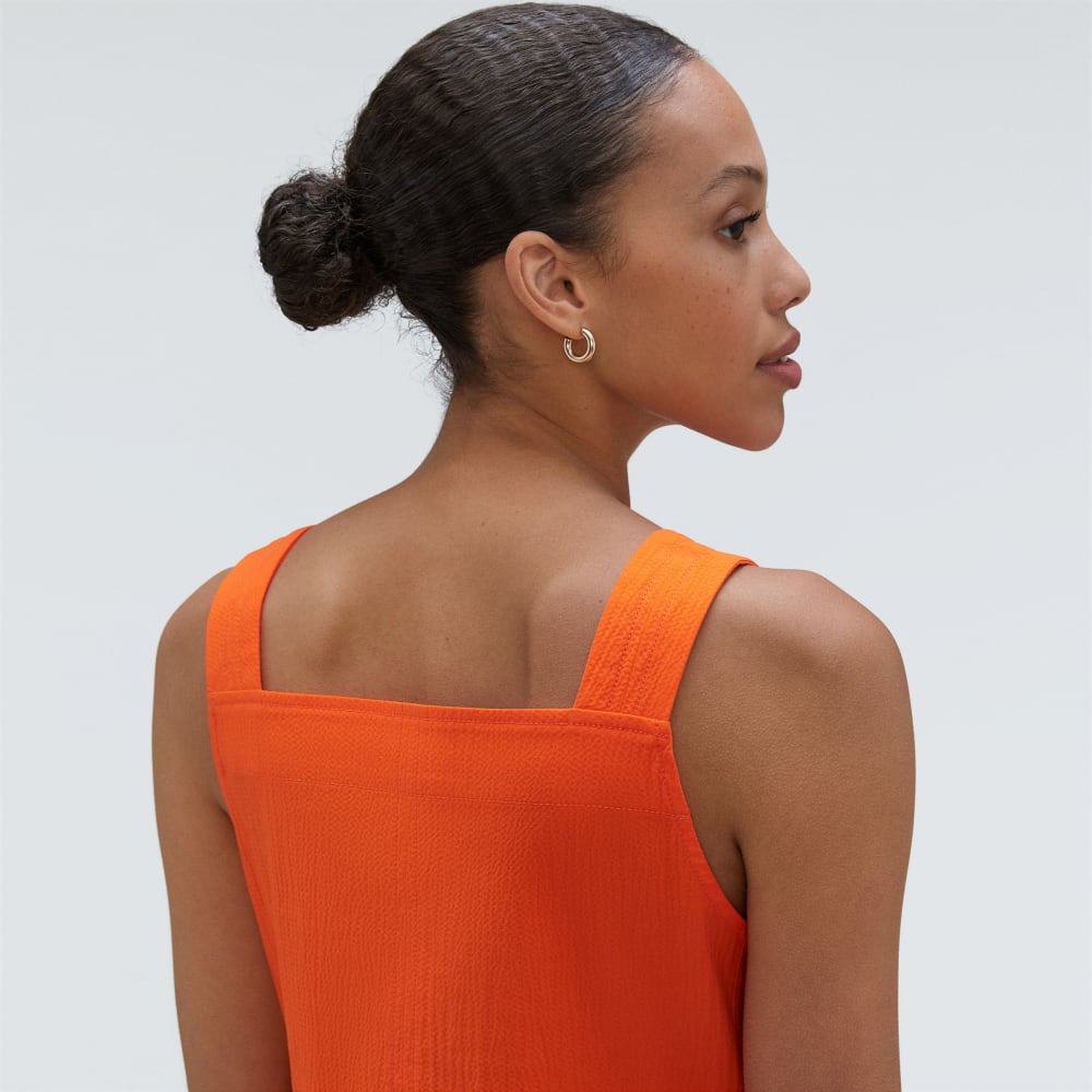 The Seersucker Midi Dress in Bright Orange — detail view