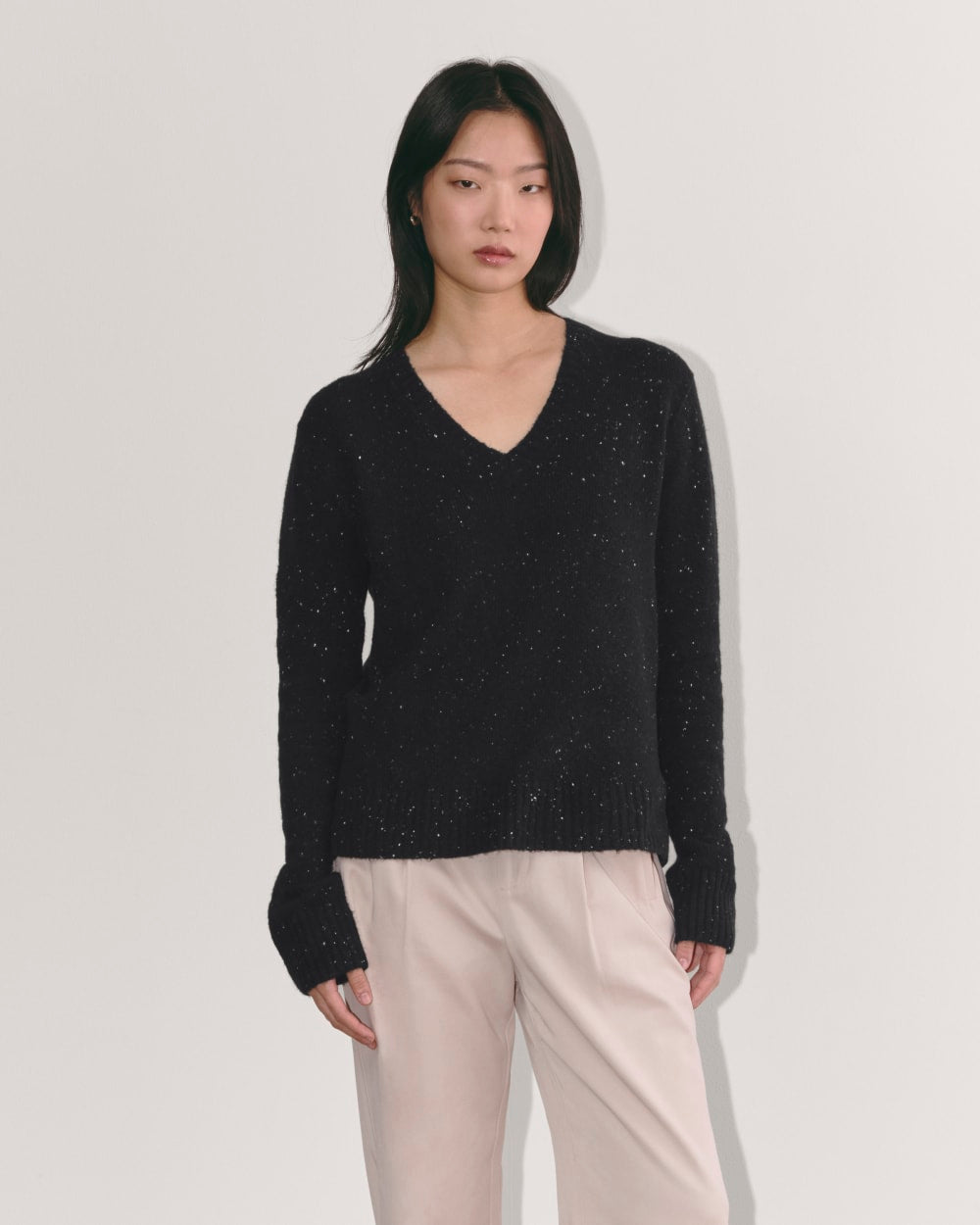 The V-Neck Sweater in Plush Cotton in Black Confetti — front view