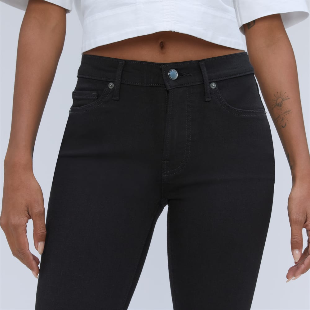 The Mid-Rise Skinny Stretch Jean in Black — detail view