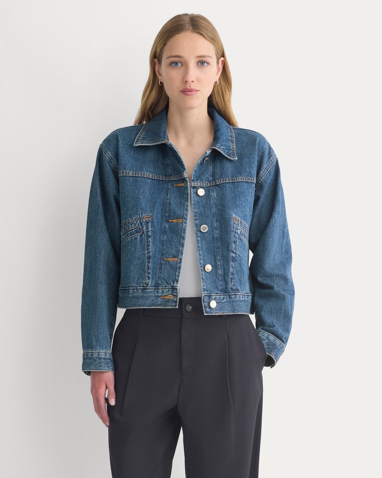 Cropped Trucker Jacket in Denim in Mid Indigo — front view