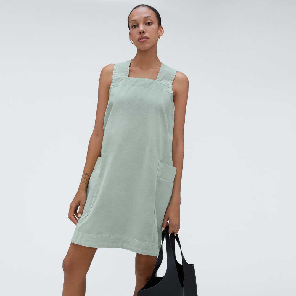 The Cross-Back Apron Mini Dress in Sea Glass — detail view