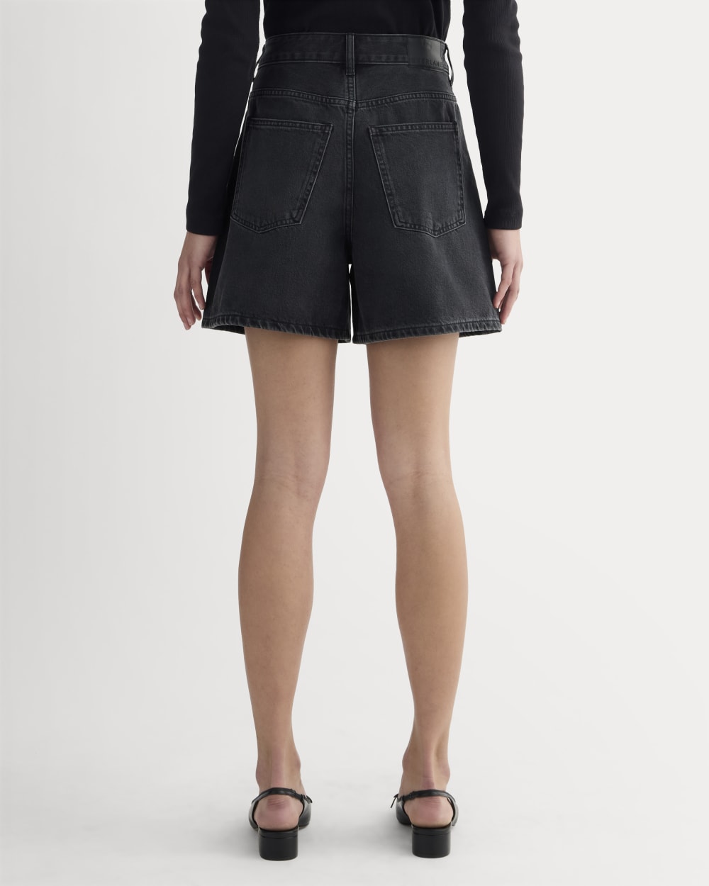 The A-Line Denim Short in Washed Black — detail view