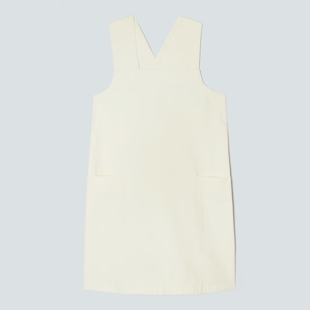 The Cross-Back Apron Mini Dress in Canvas — front view
