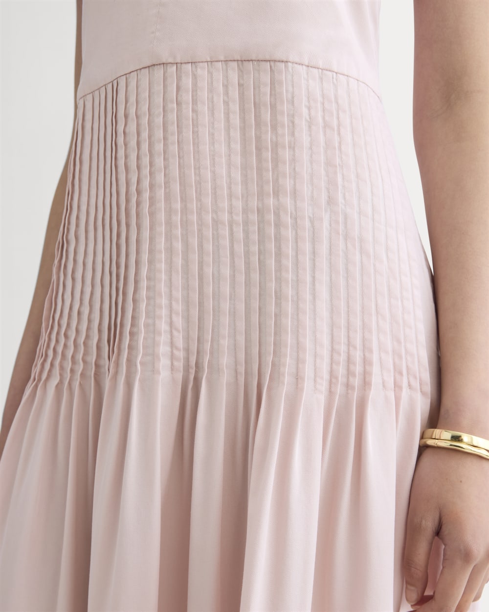 The Pleated Slip Dress in Butterlite in Soft Rose — detail view