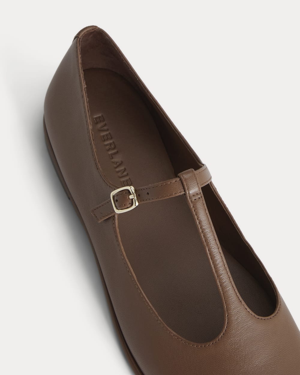 The Leather T-Strap Flat in Rum — detail view