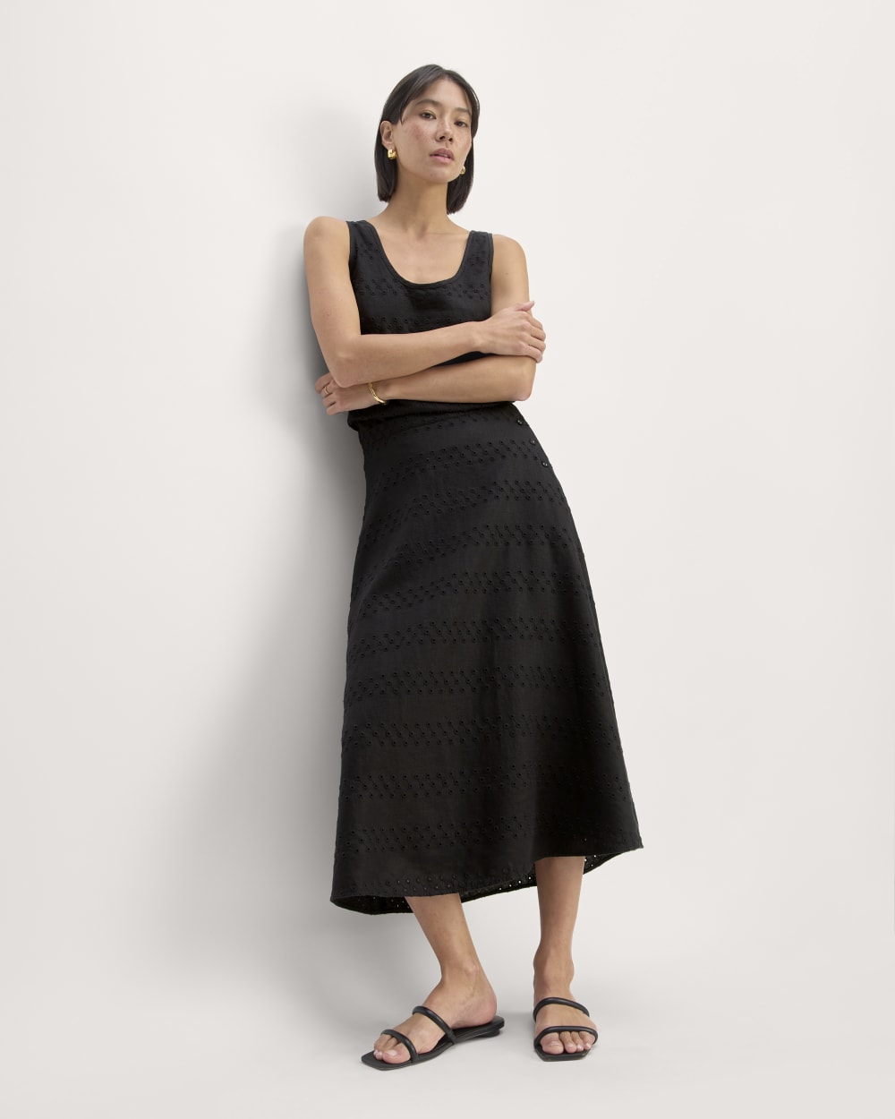 The Linen Eyelet Midi Skirt in Black Eyelet — front view