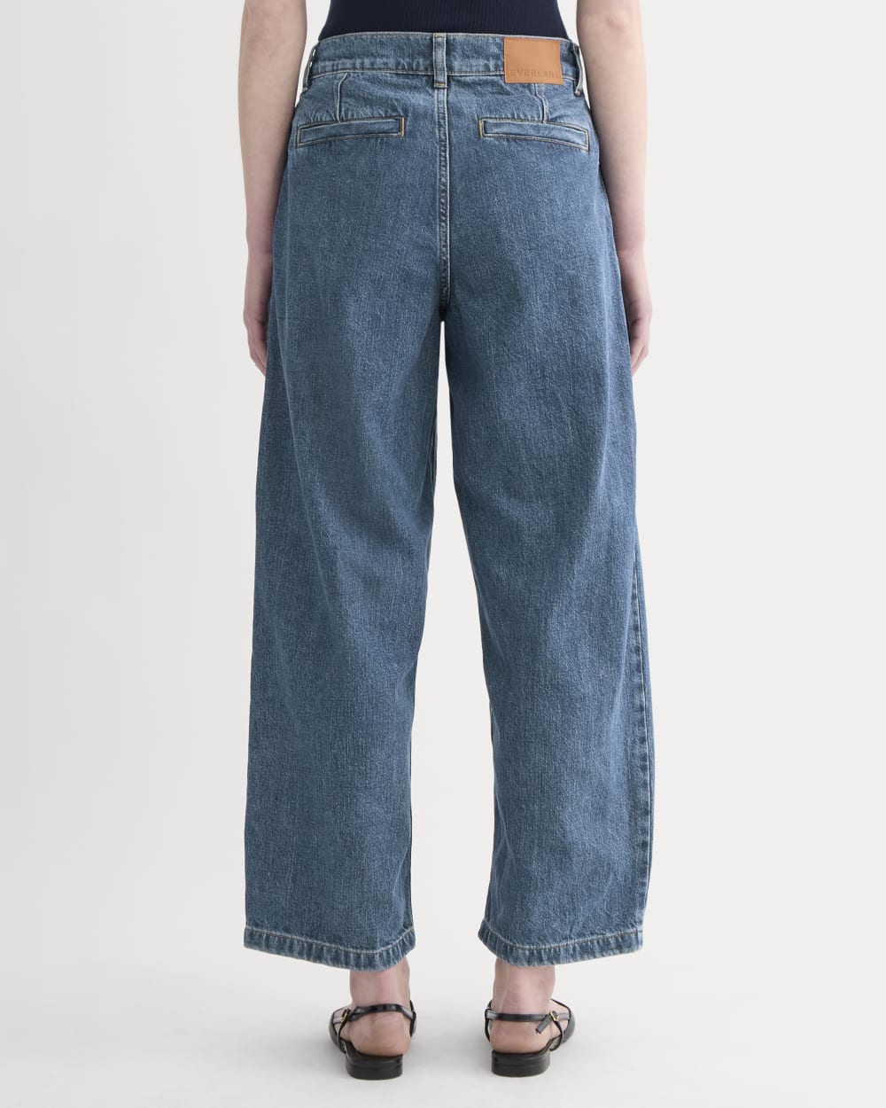The High Rise Pleated Jean in Mid Indigo — detail view