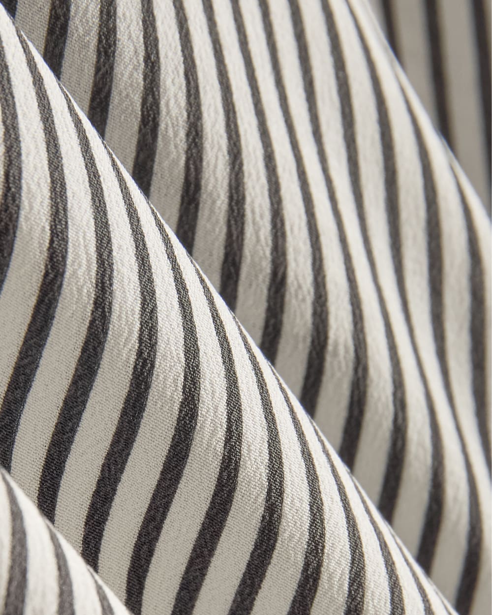 The Boxy Shirt in Washable Silk in Black Micro Stripe — detail view