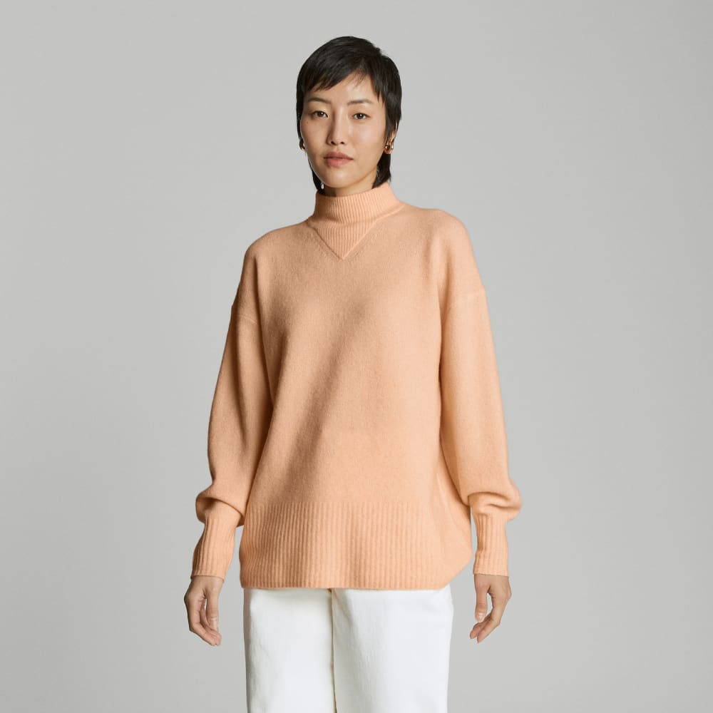 The Cozy-Stretch Pullover in Apricot — front view