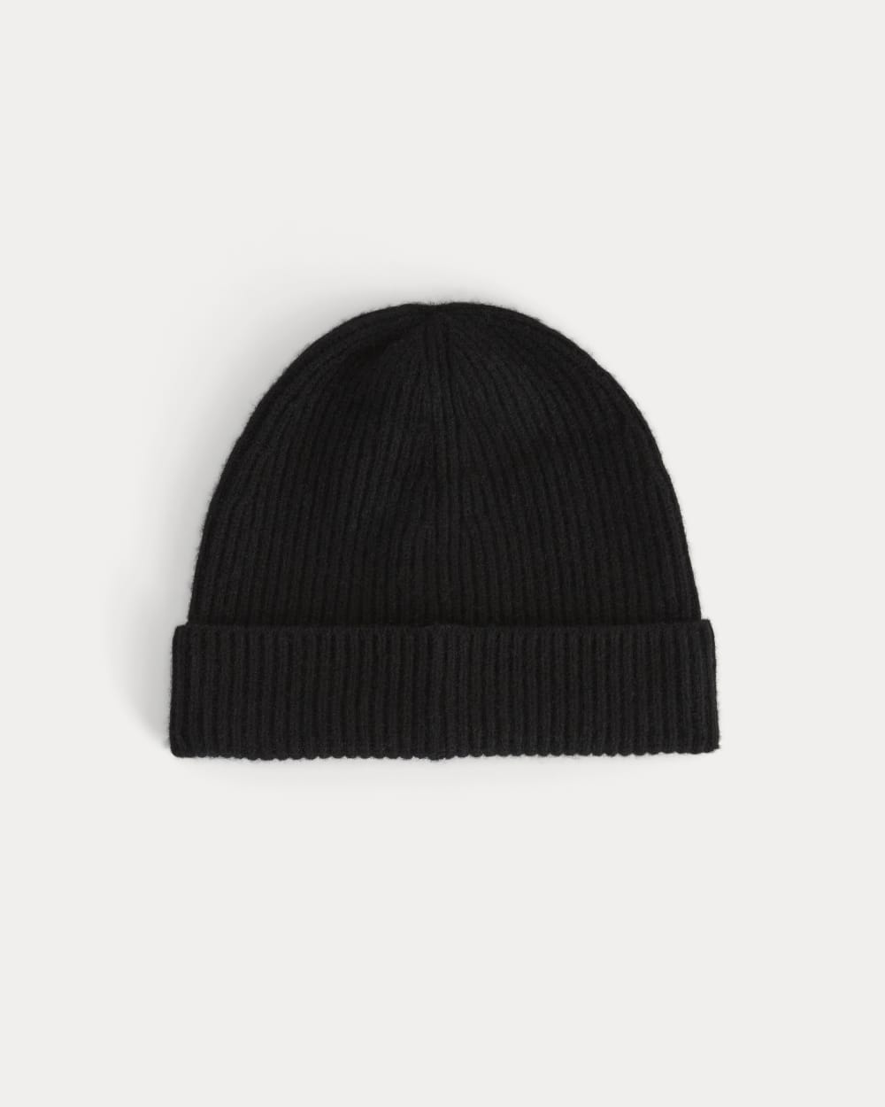 The Cashmere Ribbed Beanie in Black — front view