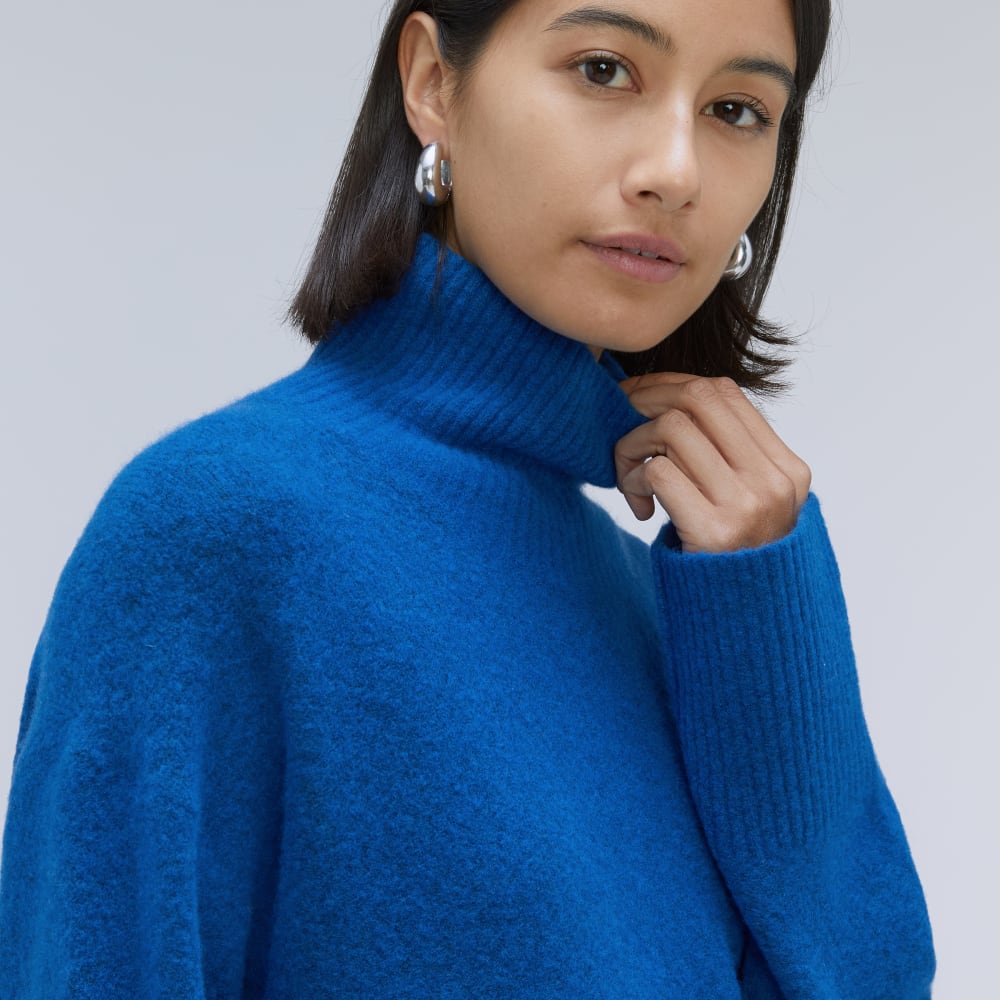 The Cozy Stretch Turtleneck Dress in Heathered Lapis Blue — detail view