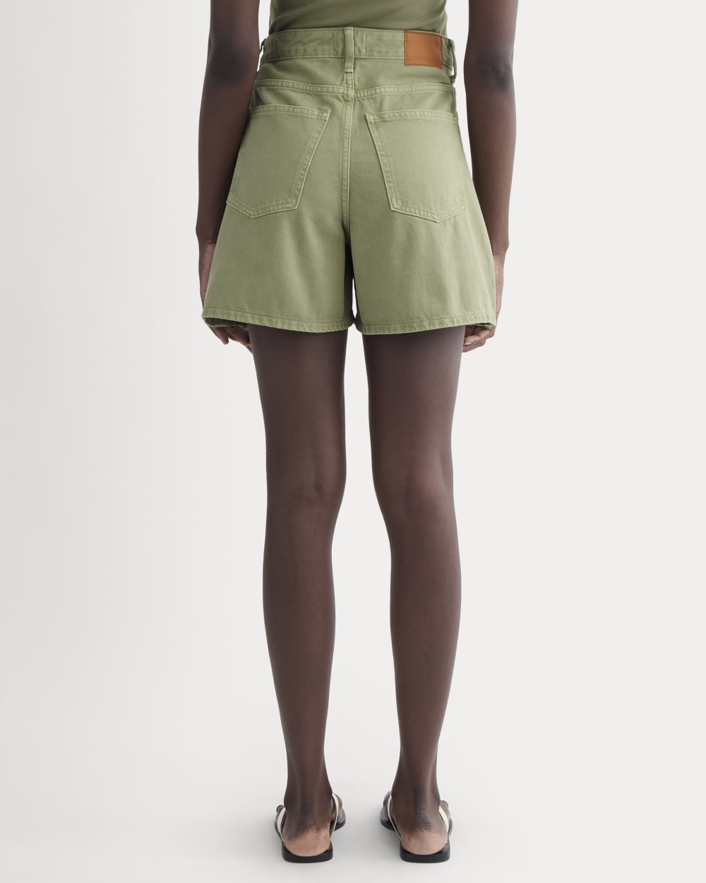 The A-Line Denim Short in Neutral Oil Green — detail view
