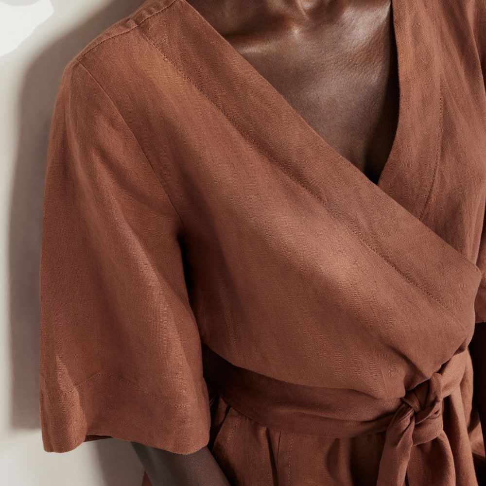 The Wrap Jumpsuit in Linen in Carob Brown — detail view