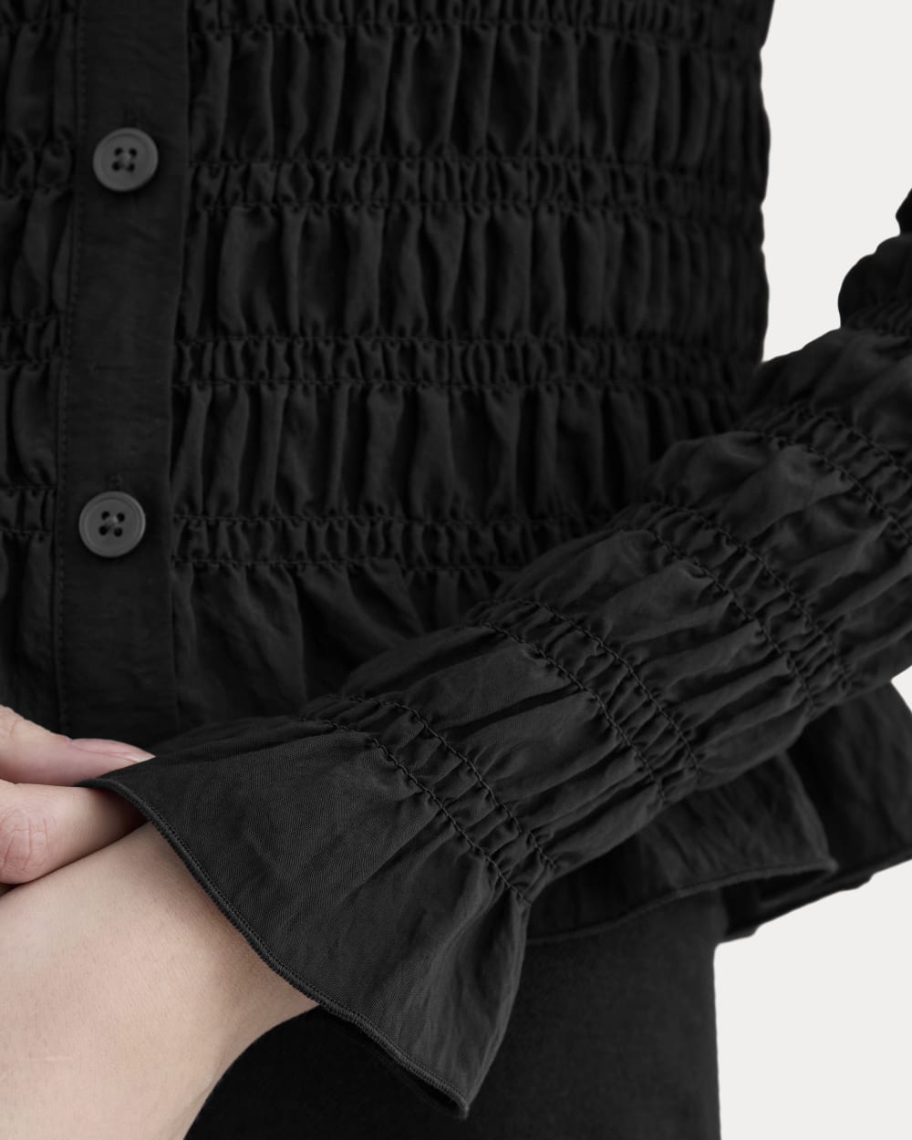 The Smocked Cardigan in Black — detail view