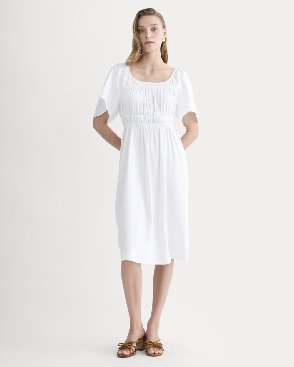 The Flutter-Sleeve Dress in Stretch Linen in White — front view