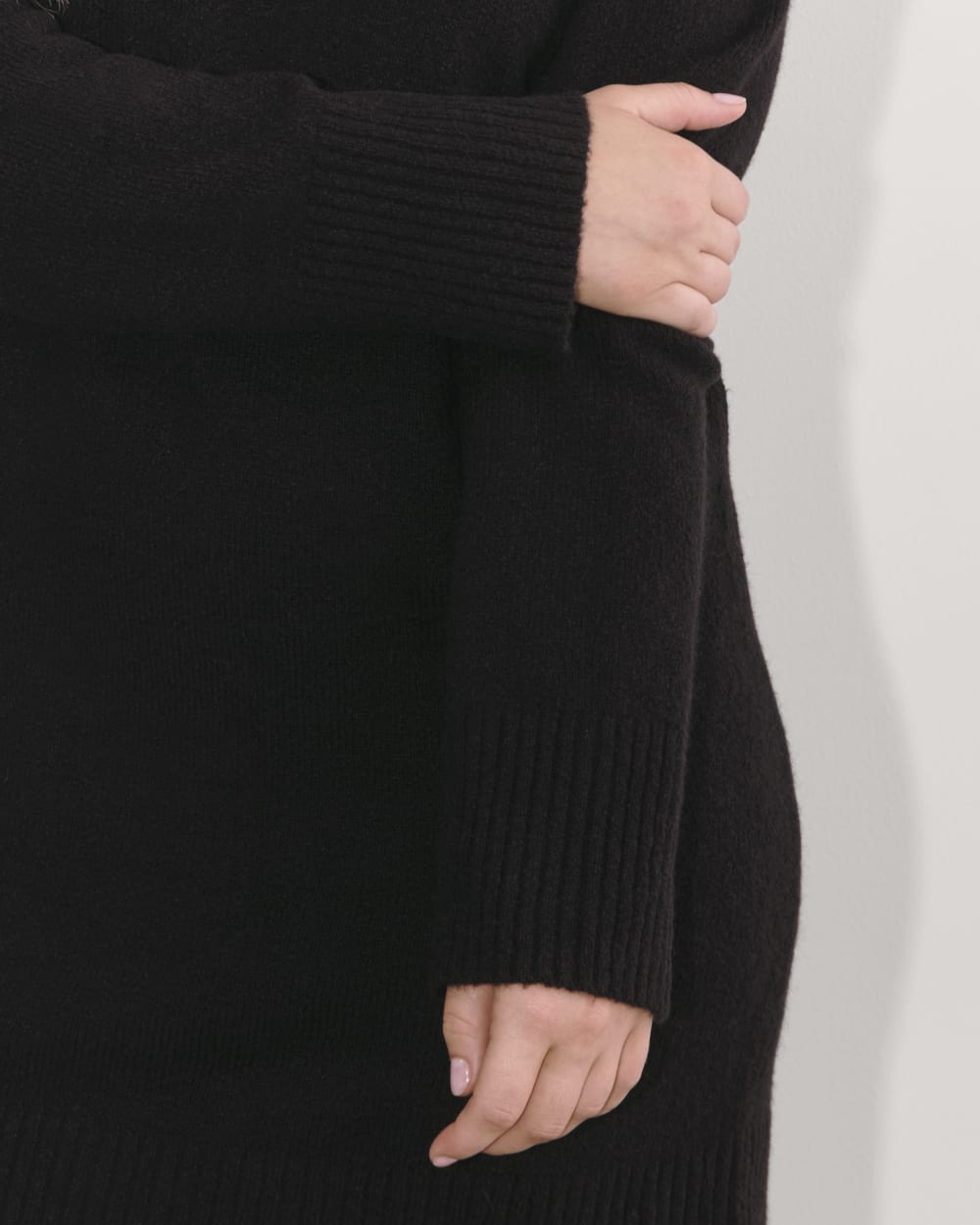 The Sweater Dress in Plush Cotton in Black — detail view
