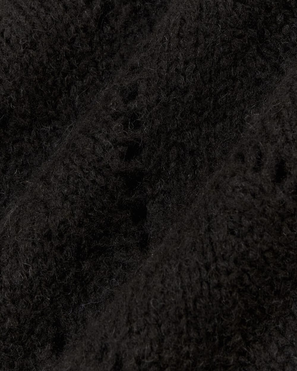 The Pointelle Sweater in Cloud in Black — detail view