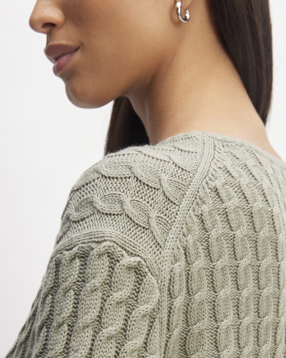 The Cotton Merino Cable Crew in Sage Green — detail view