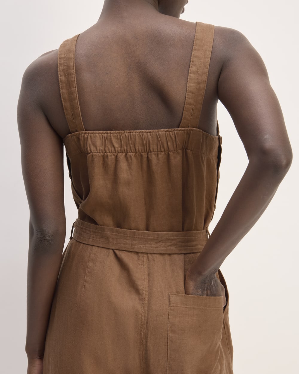 The Linen Side-Button Jumpsuit in Carob Brown — detail view