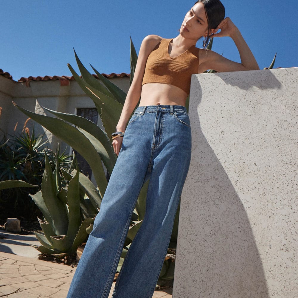 The Cross-Back Cropped Sweater Top in Butter Caramel — detail view