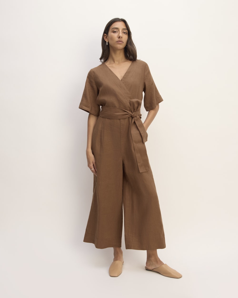The Wrap Jumpsuit in Linen in Carob Brown — front view