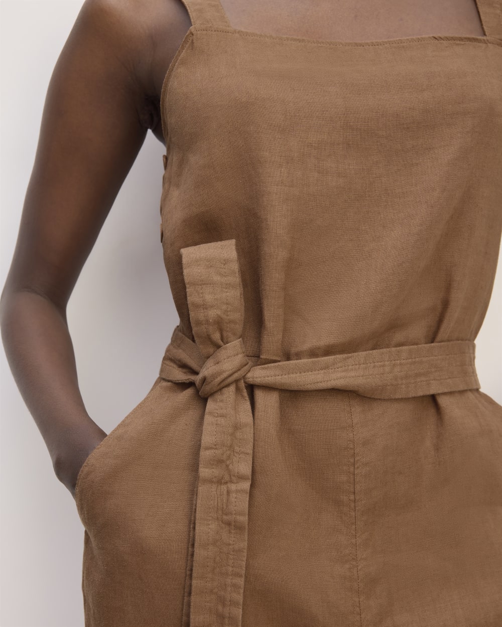 The Linen Side-Button Jumpsuit in Carob Brown — detail view