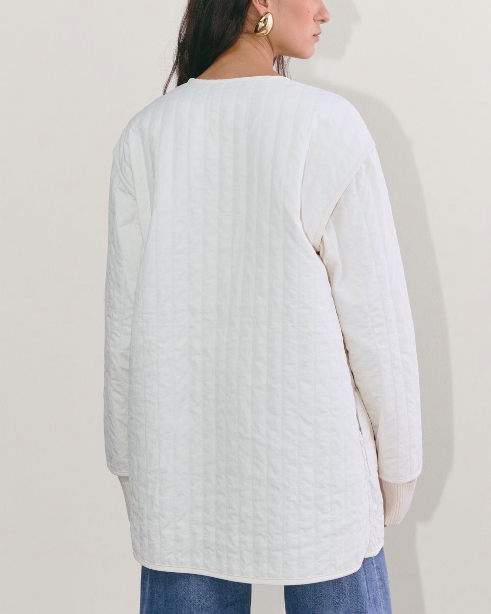The Midi Quilted Liner in Bone — detail view