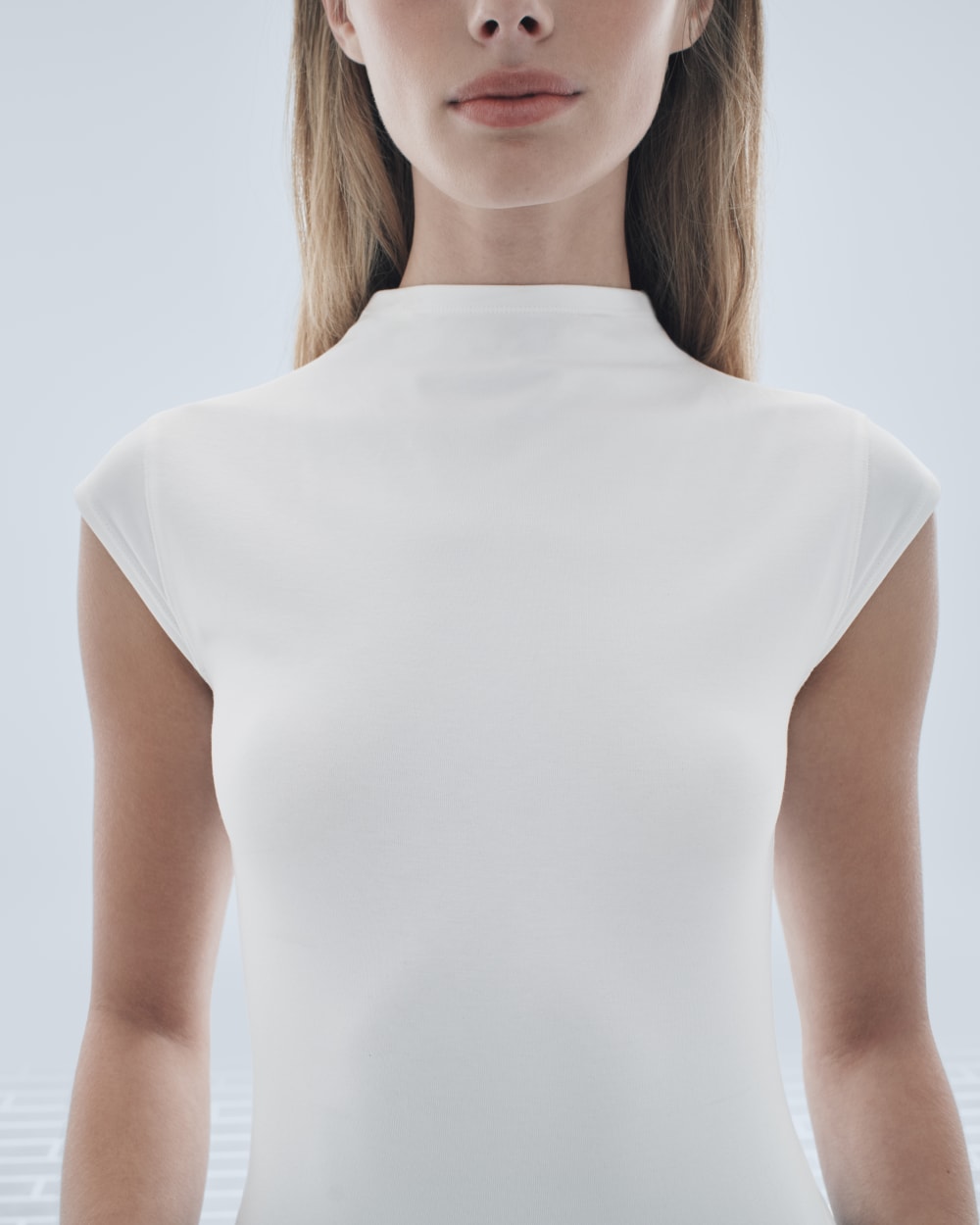 The Form Funnel-Neck Bodysuit in White — detail view