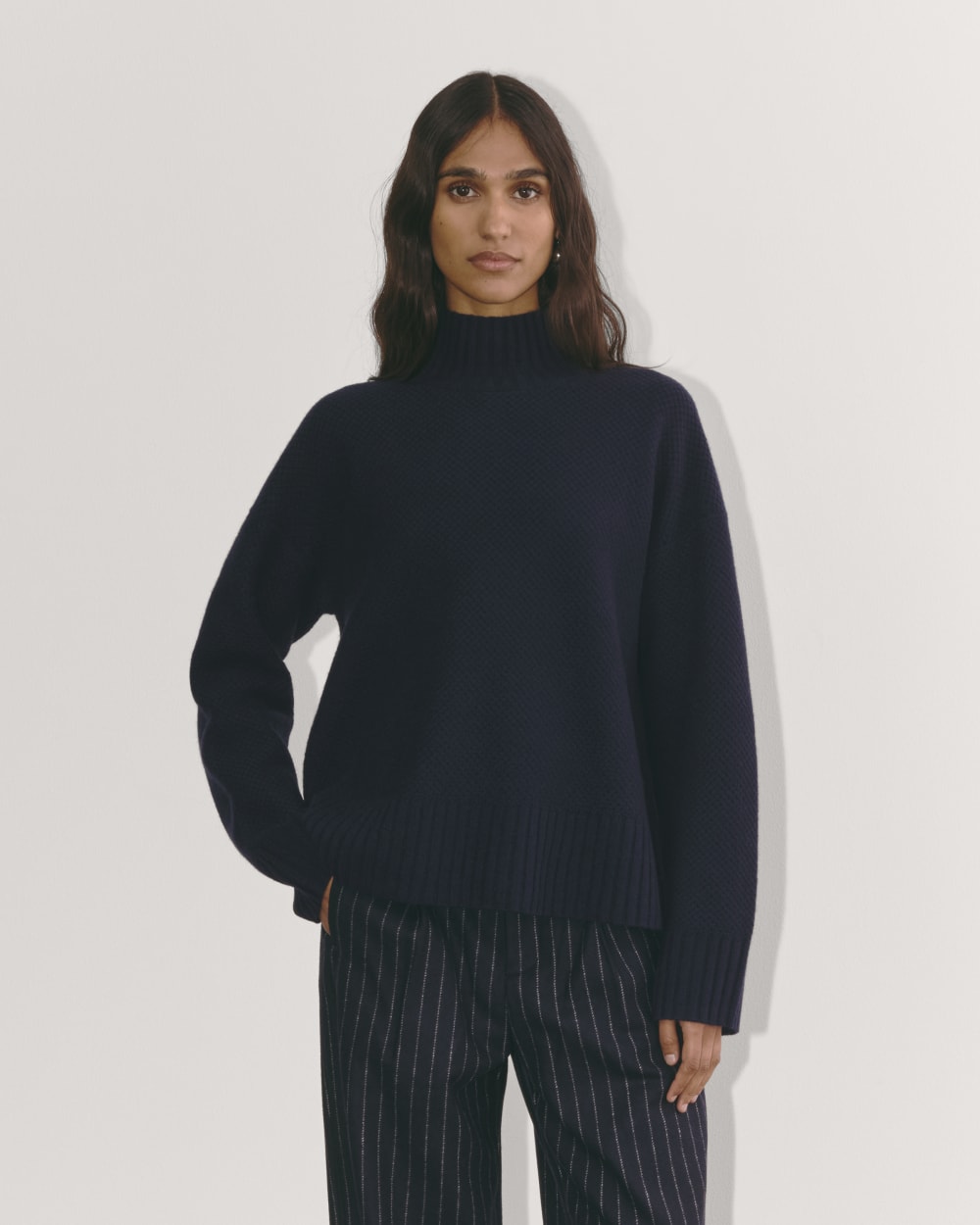 The Honeycomb Funnel Neck in Wool Cashmere in Navy — front view