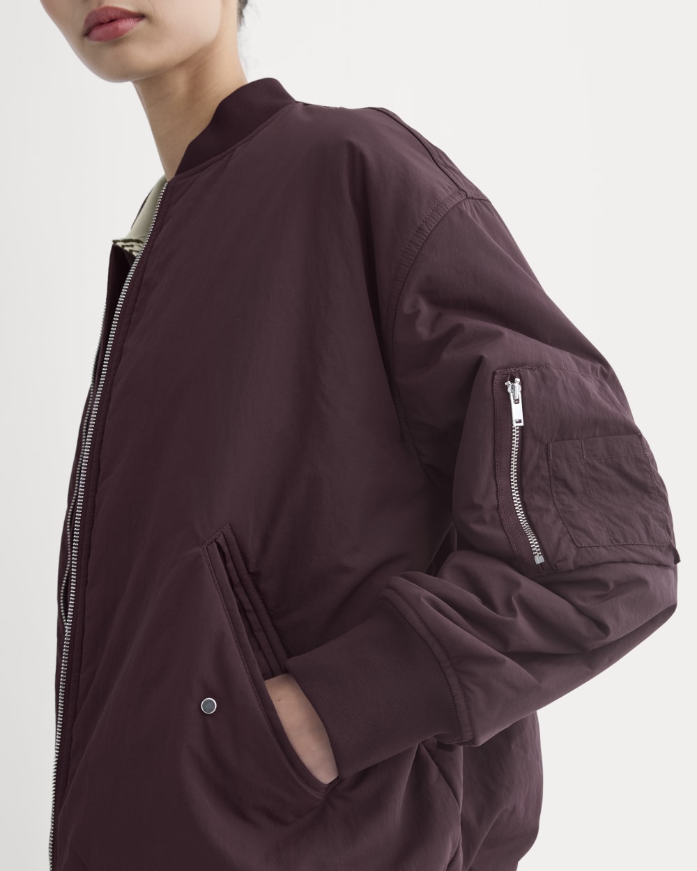 Renew Oversized Puffer Bomber in Deep Plum — detail view
