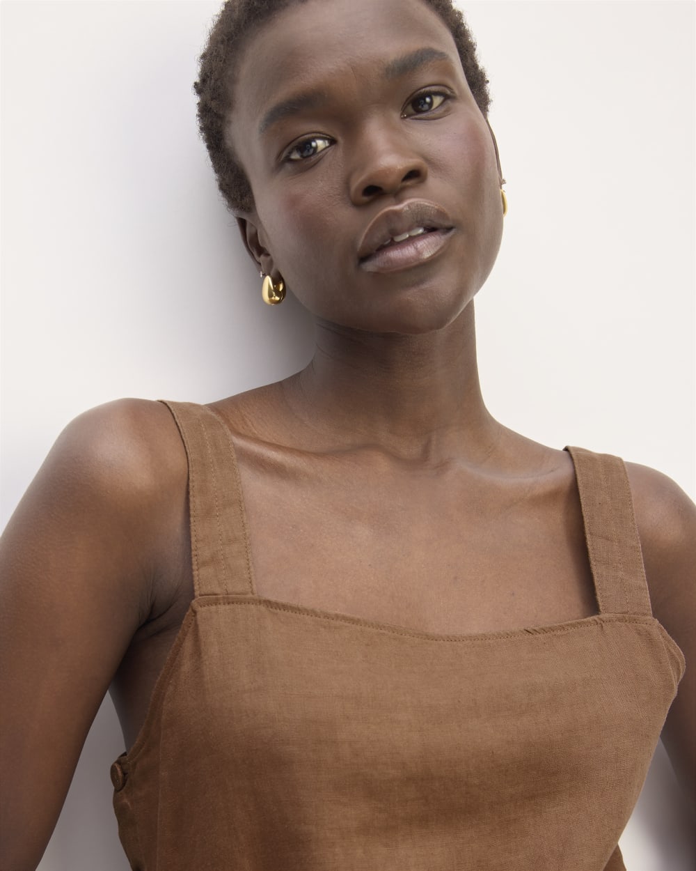 The Linen Side-Button Jumpsuit in Carob Brown — detail view